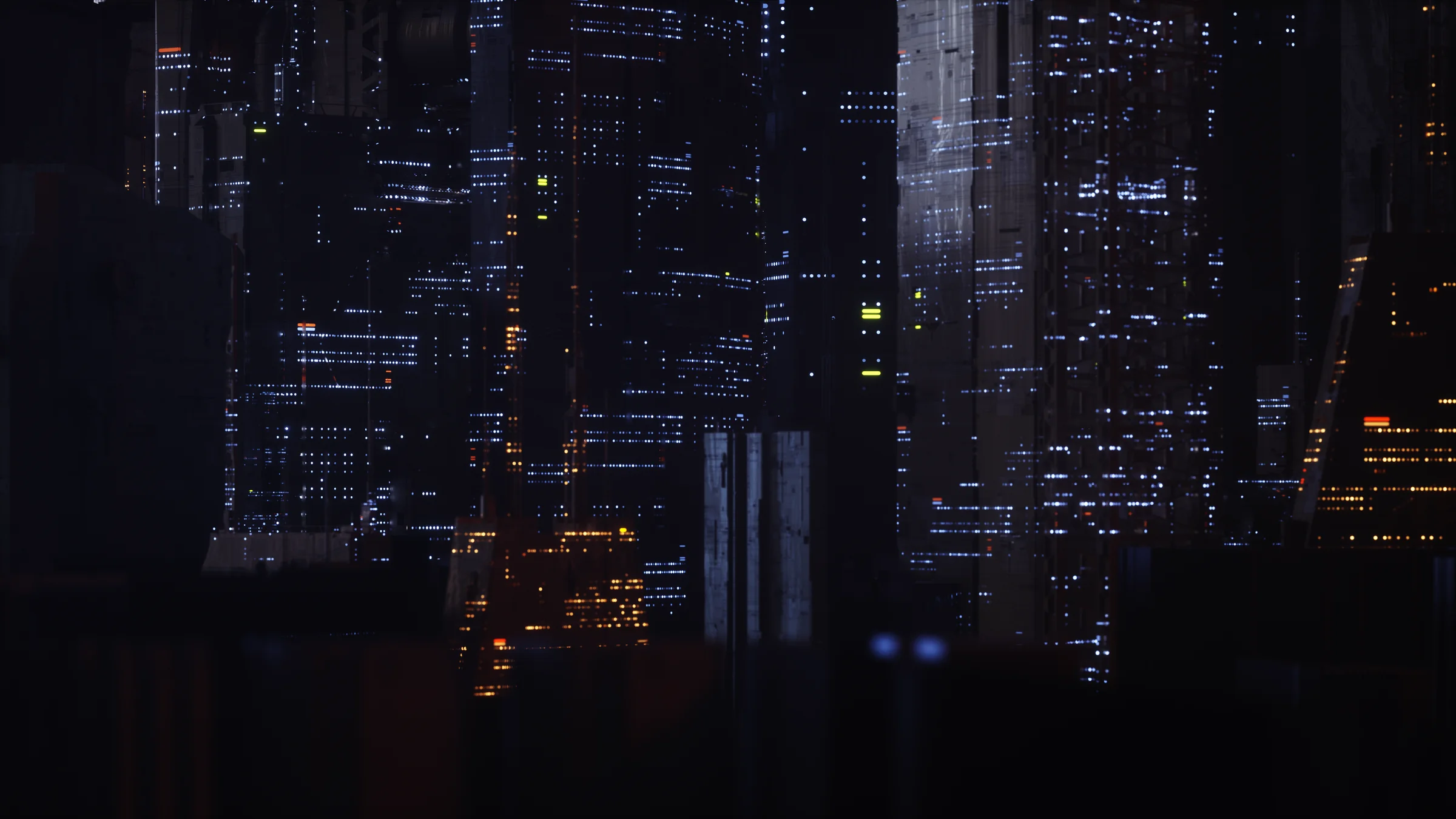 A dense futuristic skyline emerging from blue-grey fog.