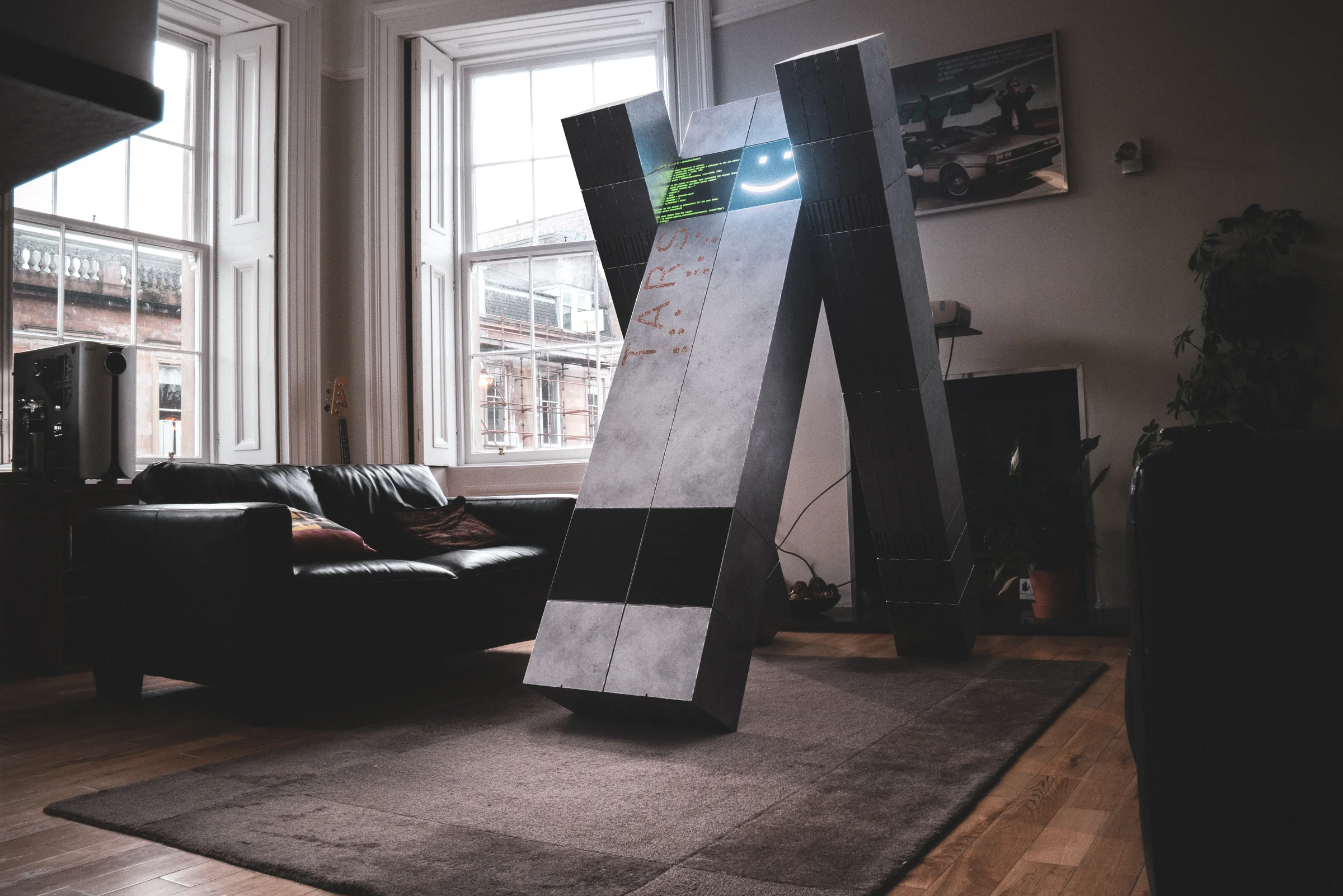TARS from Interstellar standing in a sunlit living room.